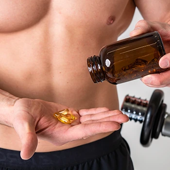 A man thinking twice before taking a supplement pill